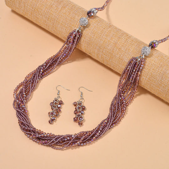 2er Set mehrschichtiger Halsketten und Ohrringe, Lila Kristallperlen und weiße Kristalle