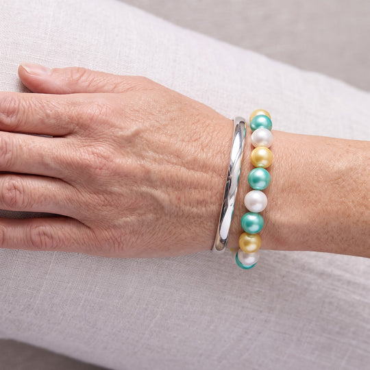 Flexibles, goldenes, weißes und grünes Muschelkernperlen-Armband