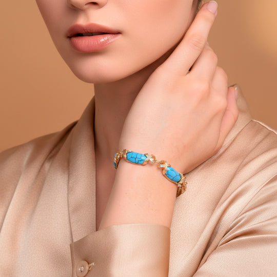 Blauer Howlit Armband, ca. 15.25 cm + 5 cm Extender, gelb vergoldet ca. 65.00 ct