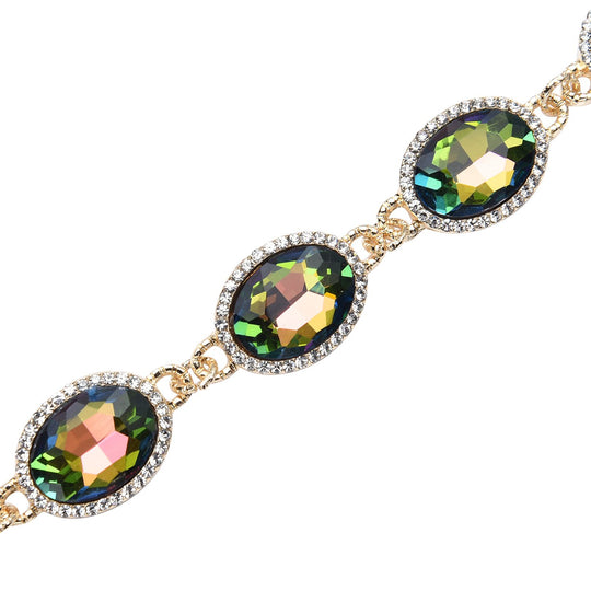 Grünes Glaskristall Armband und Ohringe, goldfarben