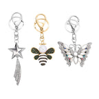 3er Set - mehrfarbige Kristall Sternschnuppe-, Biene- und Schmetterling-Schlüsselanhänger 26.60 ct