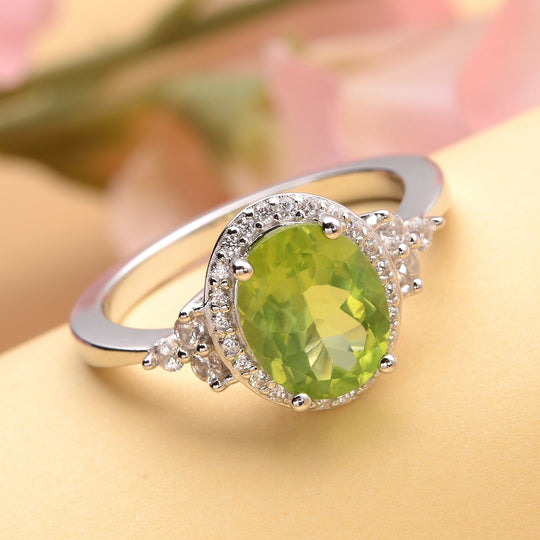 Natürlicher Peridot und weißer Zirkon Ring. 925 Silber rhodiniert ca. ca. 3.15 ct