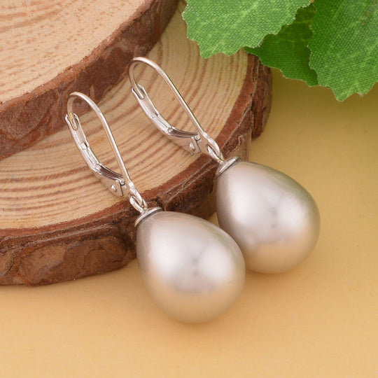 Lila Muschelkernperle (16x12 mm) Ohrringe 925 Silber Rhodiniert