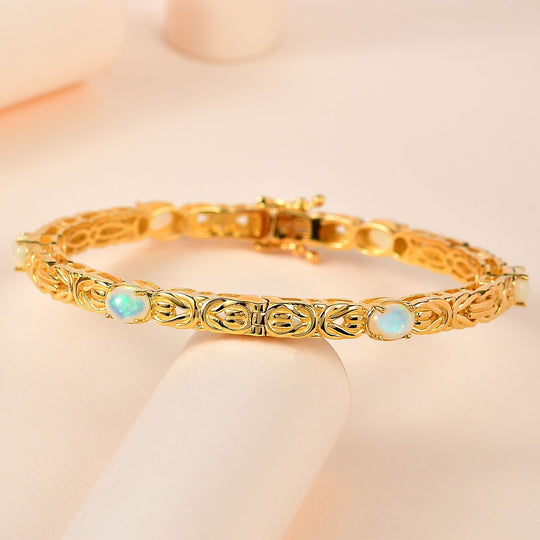 AA Natürlicher, äthiopischer Welo Opal Armreif ca. 19 cm 925 Silber Gelbgold Vermeil ca. 3.18 ct