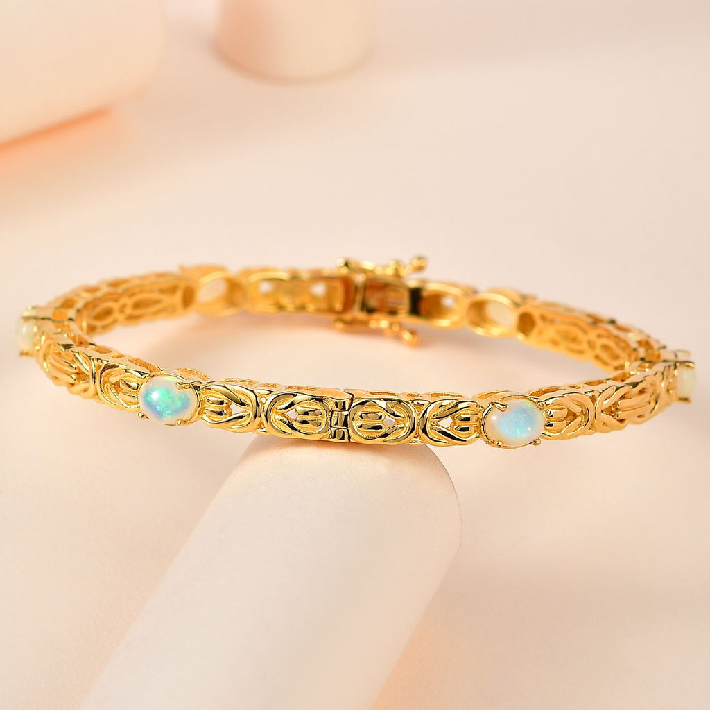AA Natürlicher, äthiopischer Welo Opal Armreif ca. 19 cm 925 Silber Gelbgold Vermeil ca. 3.18 ct