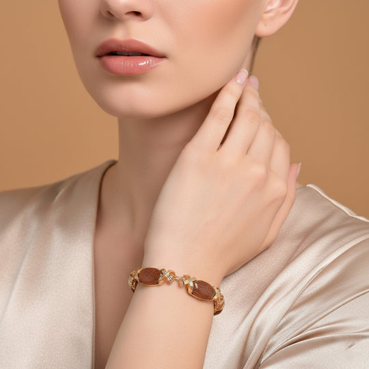 Sonnenstein Armband, ca. 15.25 cm + 5 cm Extender, gelb vergoldet ca. 65.00 ct