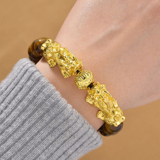 Tigerauge Armband, flexibel, vergoldet ca. 150,00 ct.