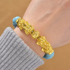 Blauer Howlit Flexibles Pixiu Armband, vergoldet ca. 150.00 ct