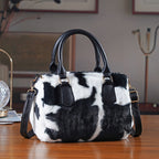 Crossbody Bag in Kuhfell-Optik, Schwarz-Weiß, 26x17x13 cm