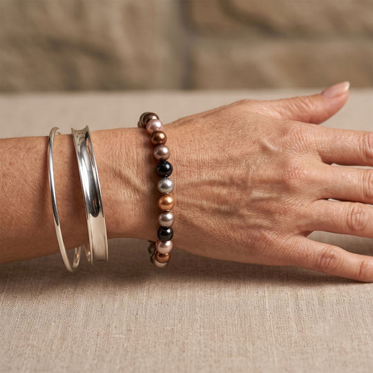 Flexibles mehrfarbiges Muschelkernperlen Armband