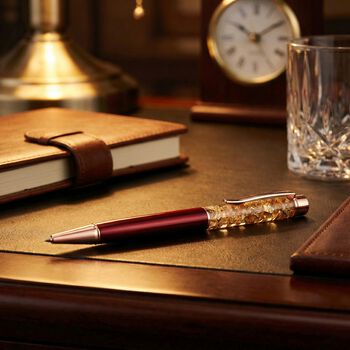 "Pen and a pen refill,  Color: transparent red genuine gold foil in the pen Box printed without logo "