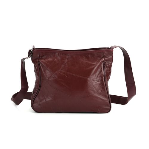 lifestyle-Color:Black size/Profile:Patch leather crossbody bag :wall(exterior); Genuine Leather;Lining(interior):polyester  Pockets(exterior):zipeed-2;Pockets(interior):zipped-1 Measurement(cm): 31*11*27 cm