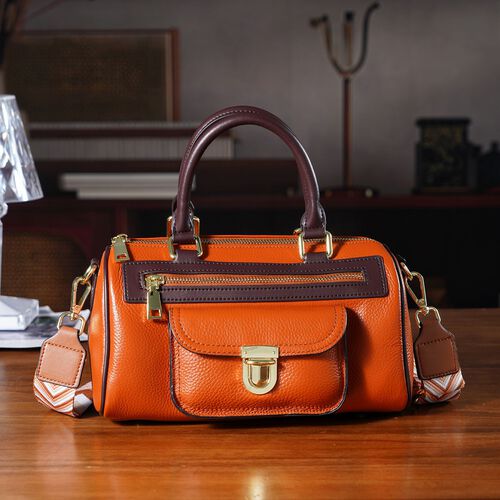 lifestyle-Color:Brown size/Profile:  Crossbody bag:wall(exterior);Genuine Leather. Lining(interior):polyester  Pockets(exterior):zipped-2;-Press button-1;Pockets(interior):Zipped-1 slip-1.Measurement(inch):10*5*5.3inch inch.Hand strap 4.7"inch. 53inch sho image number 1