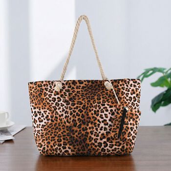 " lifestyle-Color:brown Leopard print;   Size/Profile:Set of 2 Polyester tote bag ;  Wall (exterior):Polyester,Lining (Interior):polyester  Tote bag Pockets (exterior):Zipped-1 Mini bag Pockets (exterior):zipped-1; big  size:56*36*16 cm  small size:15*12c