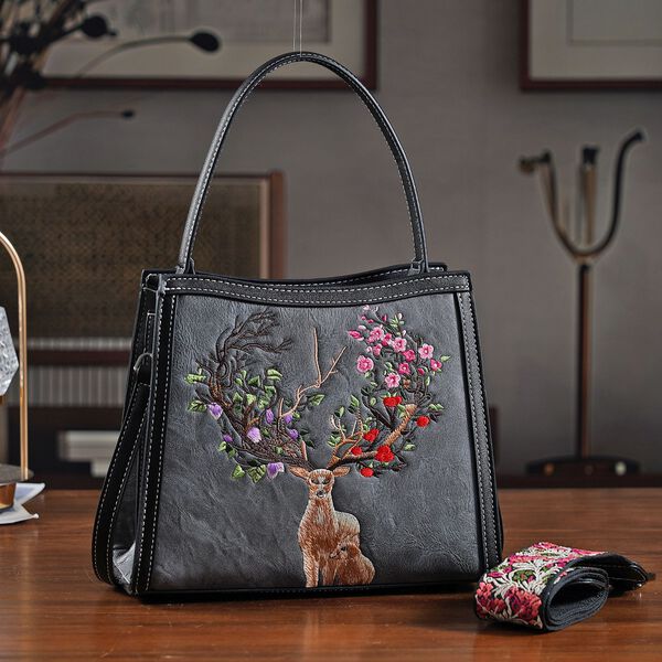 "PU Embroidered crossbody bag Color: Grey Size:  25*11*21cm   Wall: PU Lining: Polyester Exterior:zipped-1,pocket-1 Interior: zipped-2,slid-1 Long Shoulder strap:130cm " image number 1