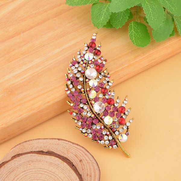 Dunkelrosa Feder-Kristallbrosche image number 1