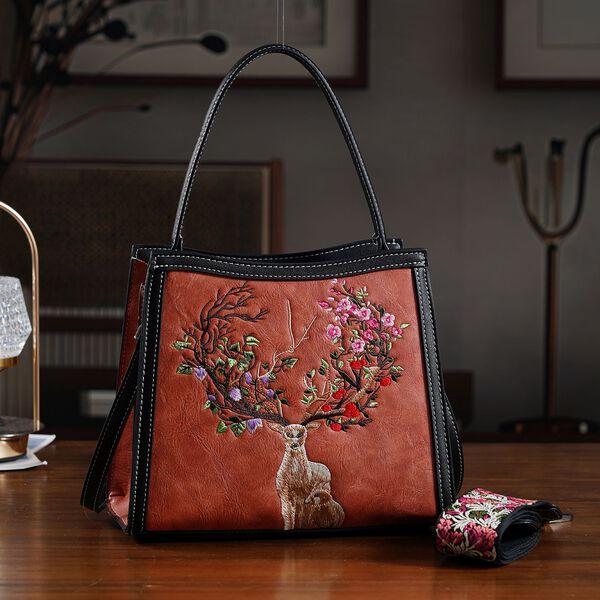 "PU Embroidered crossbody bag Color: Orange Size:  25*11*21cm   Wall: PU Lining: Polyester Exterior:zipped-1,pocket-1 Interior: zipped-2,slid-1 Long Shoulder strap:130cm " image number 9