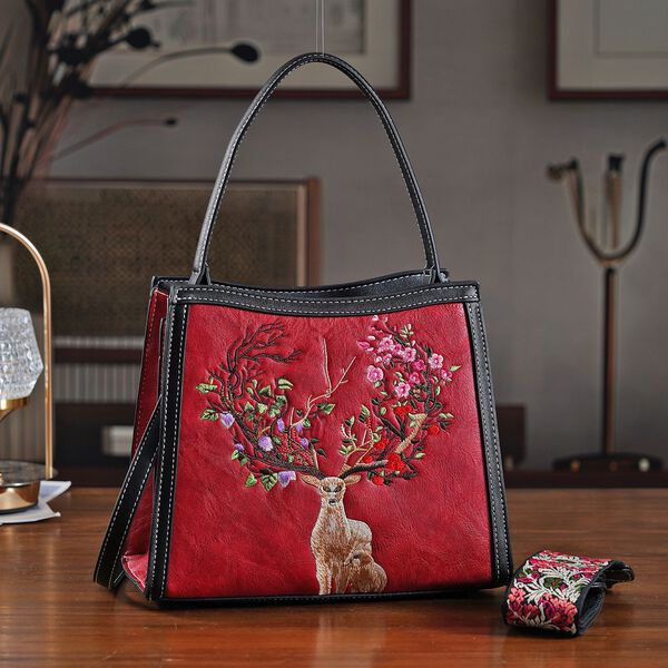 "PU Embroidered crossbody bag Color: Red  Size:  25*11*21cm   Wall: PU Lining: Polyester Exterior:zipped-1,pocket-1 Interior: zipped-2,slid-1 Long Shoulder strap:130cm " image number 1
