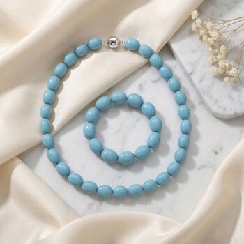 Sleeping Beauty t&uuml;rkisfarbene Oval Muschelkernperle 50cm Halskette und flexibles Armband