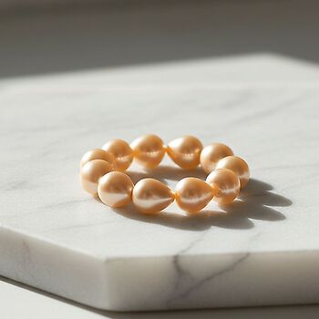 Flexibles goldenes Tropfen Muschelkernperle Armband