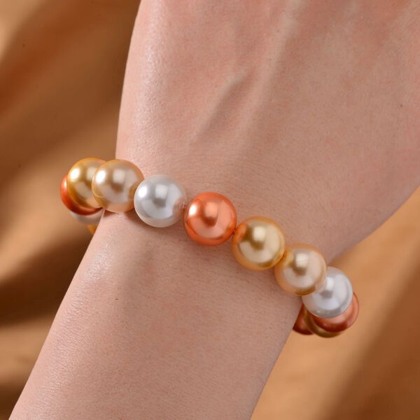 Flexibles, goldenes, wei&szlig;es und orangenes Muschelkernperlen-Armband image number 2
