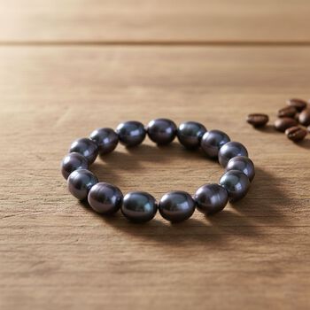 Flexibles pfaufarbenes Oval Muschelkernperle Armband