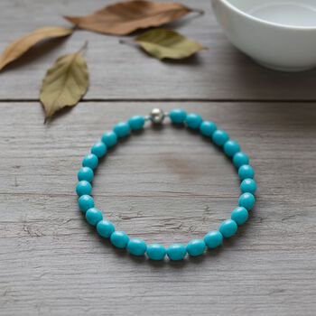 Sleeping Beauty t&uuml;rkisfarbene Oval Muschelkernperle 50cm Halskette und flexibles Armband