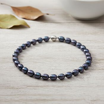 Pfaufarbene Oval Muschelkernperle 50cm Halskette und flexibles Armband