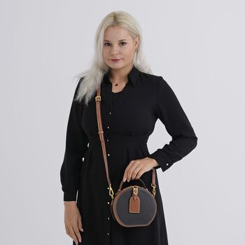 lifestyle-Color:Black with tan ;size/Profile:  Crossbody bag:wall(exterior);Genuine Leather. Lining(interior):polyester  Pockets(exterior):zipped-1;Pockets(interior):pocket-1                                Measurement:11*8*16CM