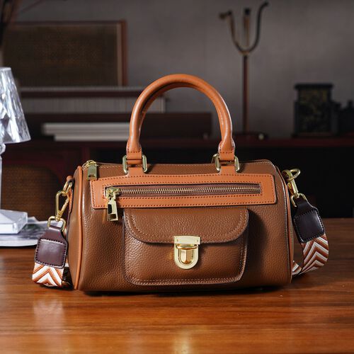 lifestyle-Color:Coffee size/Profile:  Crossbody bag:wall(exterior);Genuine Leather. Lining(interior):polyester  Pockets(exterior):zipped-2;-Press button-1;Pockets(interior):Zipped-1 slip-1.Measurement(inch):10*5*5.3inch inch.Hand strap 4.7"inch. 53inch sh image number 1