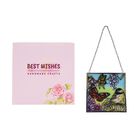 "Glass Suncatcher pendant with chain and silver frame -Square shape Size : 11.5x11.5cm Weight: 220g Material: Metal frame+ glass Color: Multicolor Design: Birds with butterfly "